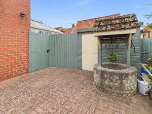 Side paved area/well/potting shed- click for photo gallery